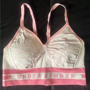 Pink and white Under Armour sports bra